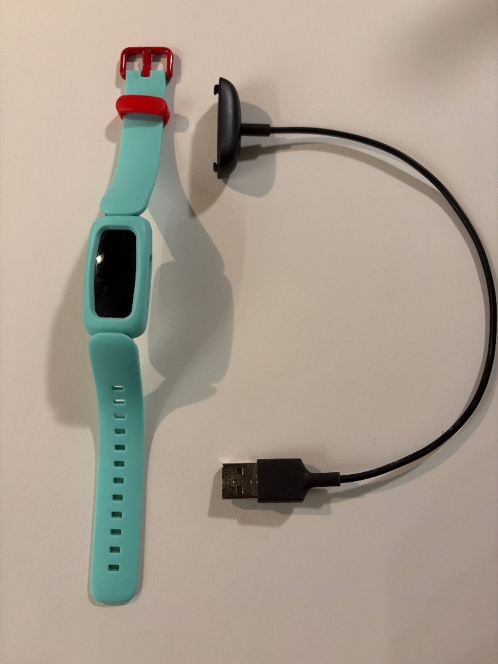 Fitbit Ace 3 with USB charging cord